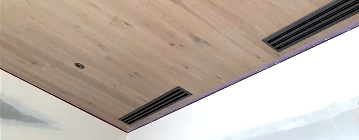 Ducted heat pump vents in timber ceiling installed by Hepburn Electrical