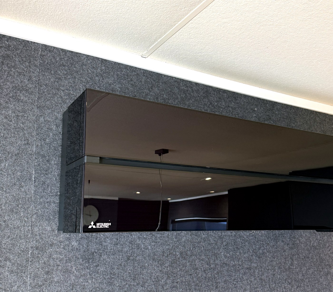 Mitsubishi Electric black heat pump installed by Hepburn Electrical Rotorua
