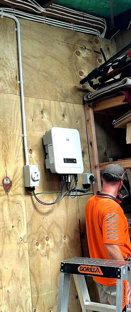 Hepburn Electrical technician installing solar inverter