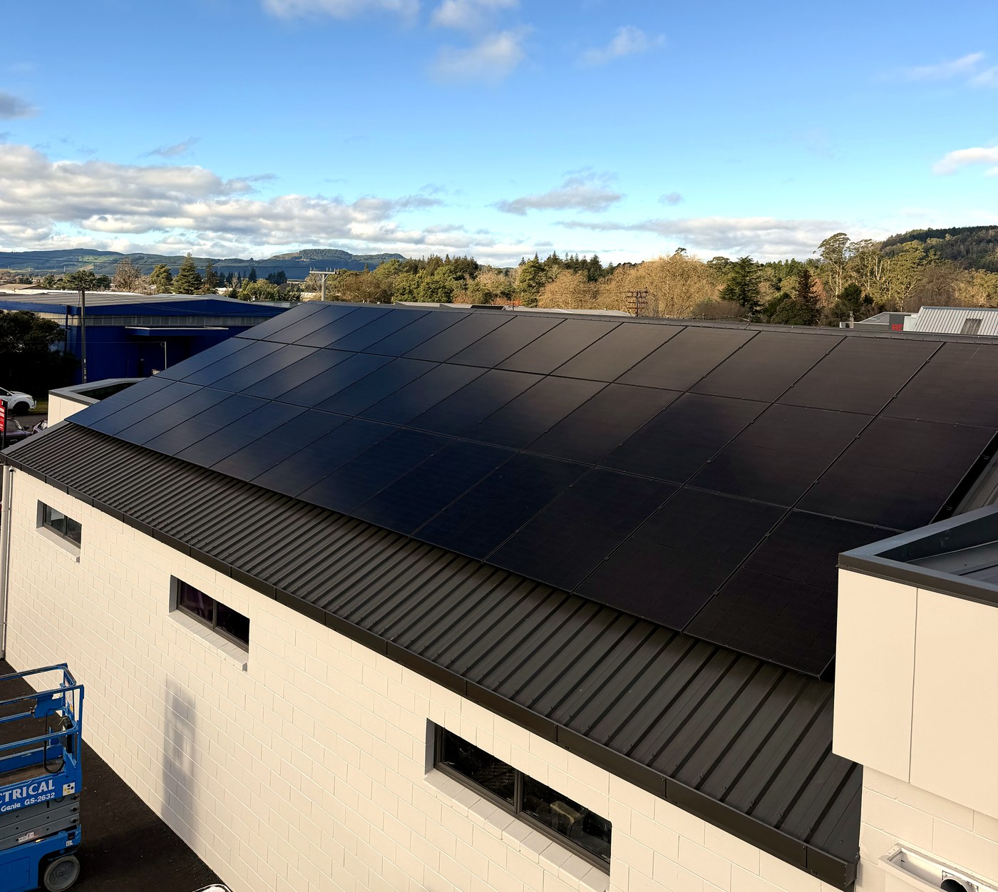 Commercial solar panel installation on industrial roof by Hepburn Electrical Rotorua